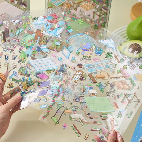 Carnet à spirales contenant 6 scènes de stickers isométrique 3D à composer soi-même sur le thème des maisons. Activité créative pour adulte pour gérer le stress.