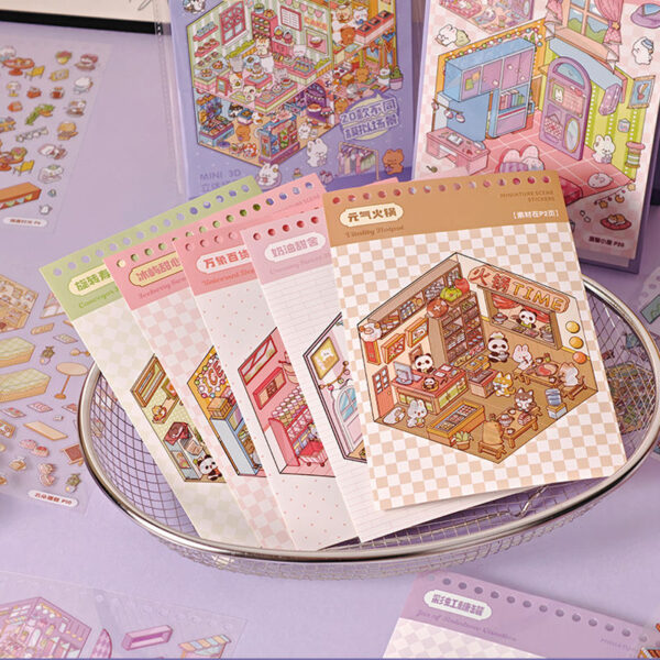 Carnet à spirales contenant 20 scènes de stickers isométrique 3D à composer soi-même sur le thème des boutiques kawaii et mignonnes. Activité créative pour adulte pour gérer le stress.