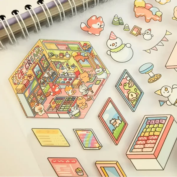 Carnet à spirales contenant 20 scènes de stickers isométrique 3D à composer soi-même sur le thème des boutiques kawaii et mignonnes. Activité créative pour adulte pour gérer le stress.