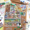 Scène de stickers isométrique 3D à composer soi-même sur le thème du puzzle et de la pellicule de film. Activité créative pour adulte pour gérer le stress.