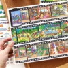 Scène de stickers isométrique 3D à composer soi-même sur le thème du puzzle et de la pellicule de film. Activité créative pour adulte pour gérer le stress.